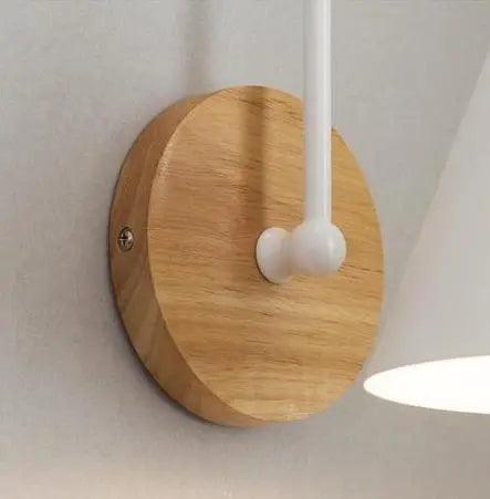 Close view of the round wood backplate and the curved arm