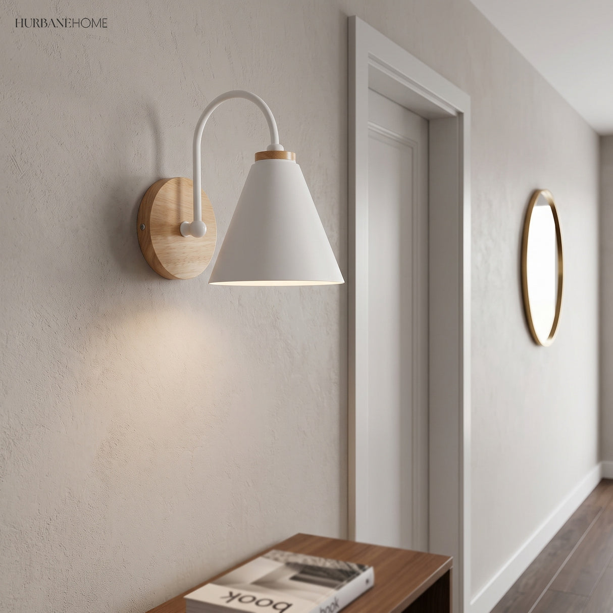 White cone shade sconce lit on a wall in a hallway
