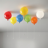 Seven coloured balloon lights fitted across a white ceiling