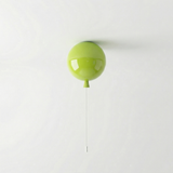 Lime green balloon light fitted to a ceiling with a pull cord