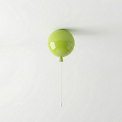 Lime green balloon light fitted to a ceiling with a pull cord