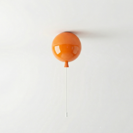 Orange balloon light fitted to a ceiling above a plain wall