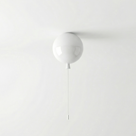 White balloon light fitted to a ceiling above a plain grey wall