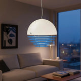 Orange dome pendant fully lit showing the banded glow through the rings