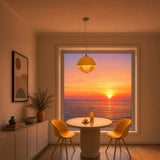 Orange pendant light showing the tiered ring discs beneath the dome