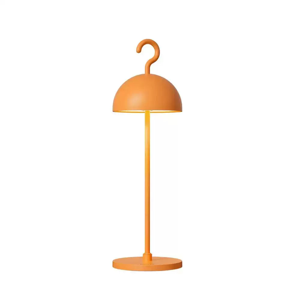 Orange cordless dome table lamp with curved hook top on a slim metal stem