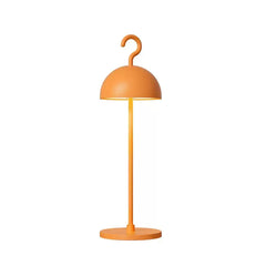 Orange cordless dome table lamp with curved hook top on a slim metal stem