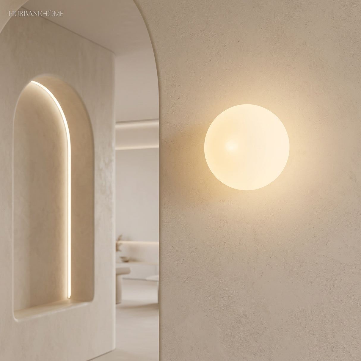 Frosted glass orb wall sconce in a styled interior