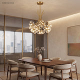 Gold sputnik dandelion chandelier above a wooden dining table