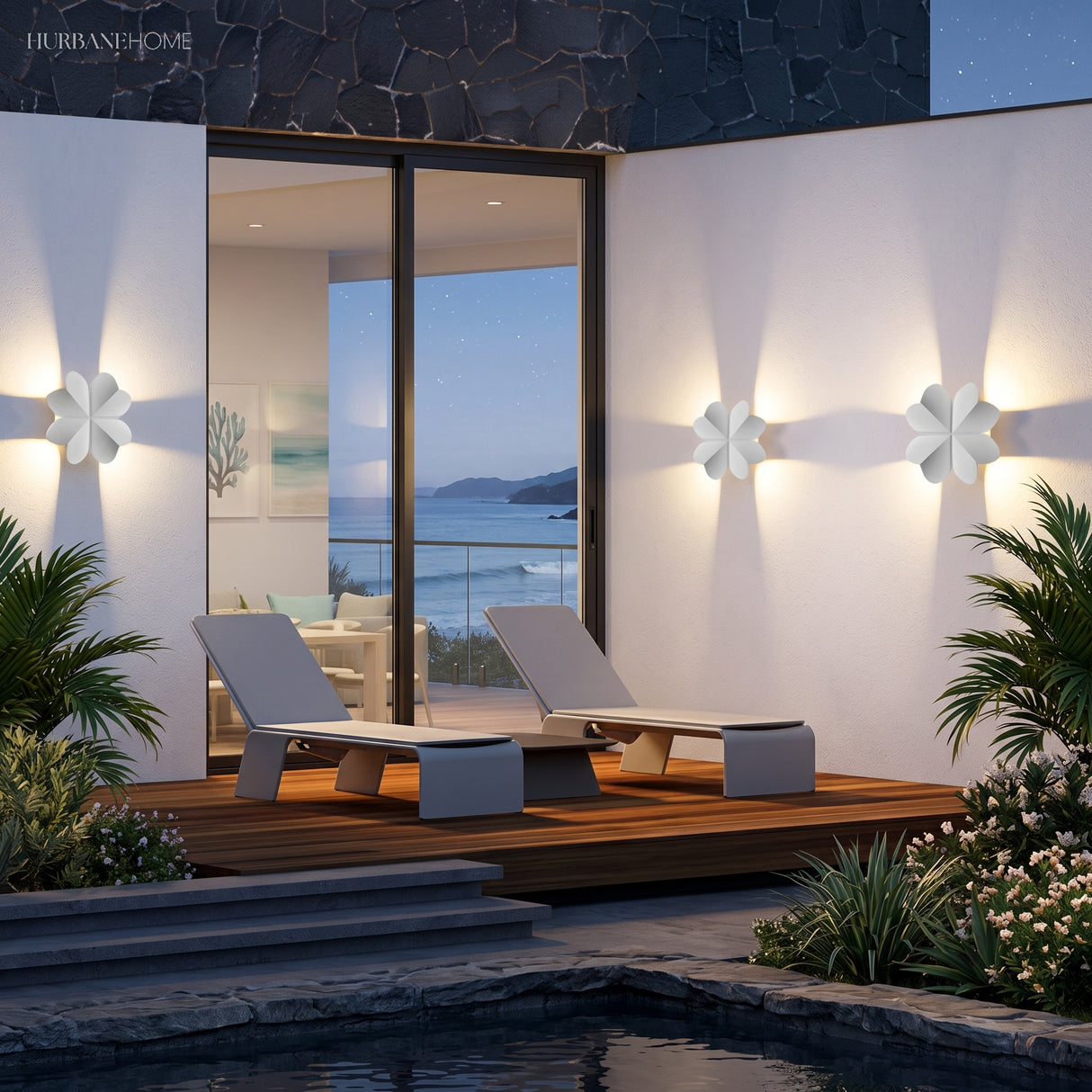 Starfish and seagull lights lit along a poolside terrace wall