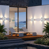 Starfish and seagull lights lit along a poolside terrace wall
