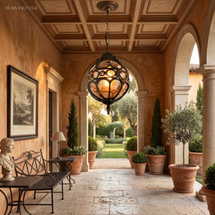 Two caged pendants lighting a covered terrace with timber ceiling
