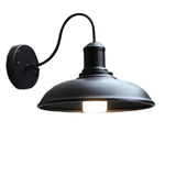 Black gooseneck barn light with a straight shade on white