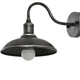 Antique silver barn light seen from the side on a white ground