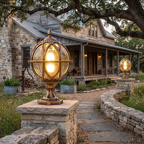 Globe post light on a stone pier beside a gravel driveway