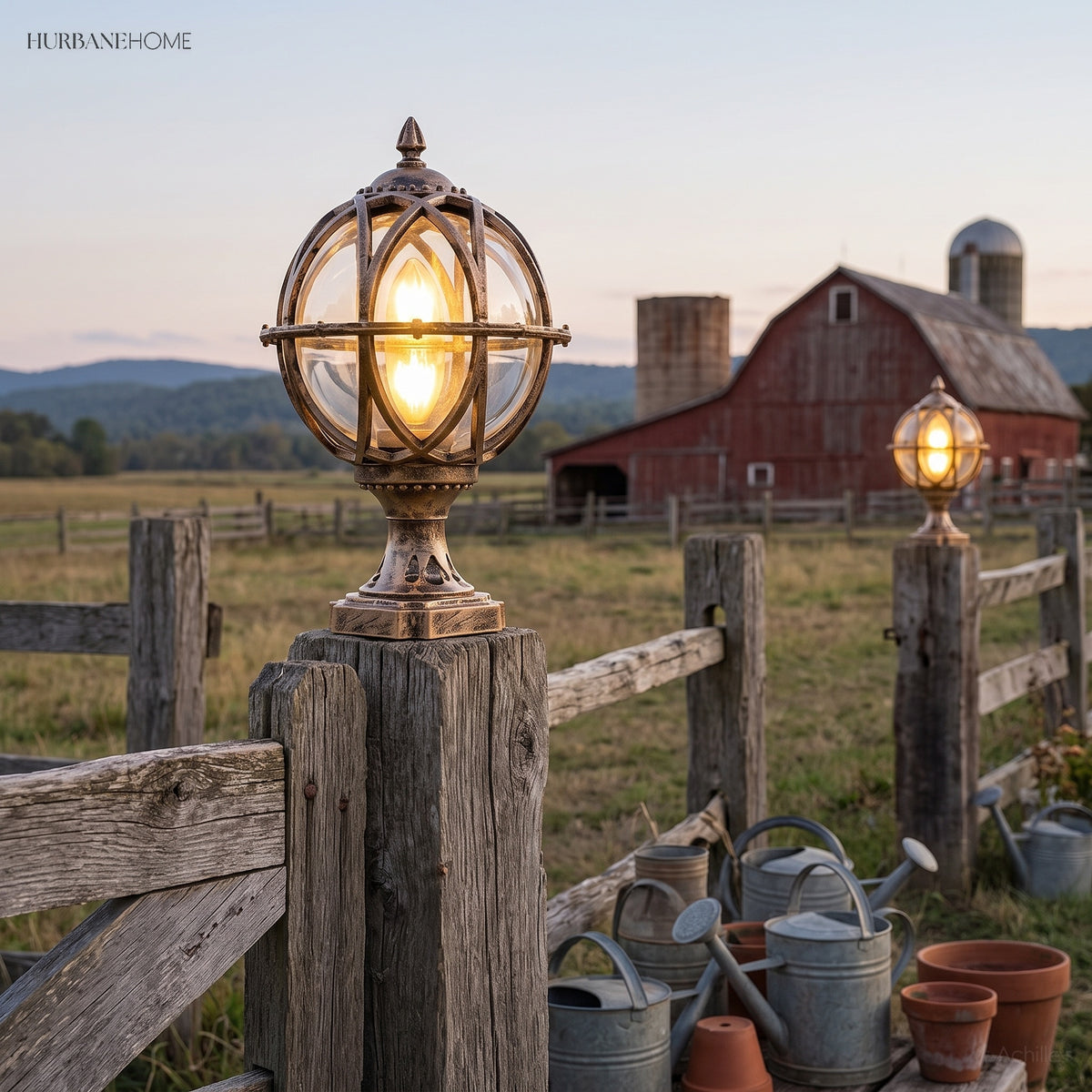 Pair of caged post lights on white columns beside a picket fence