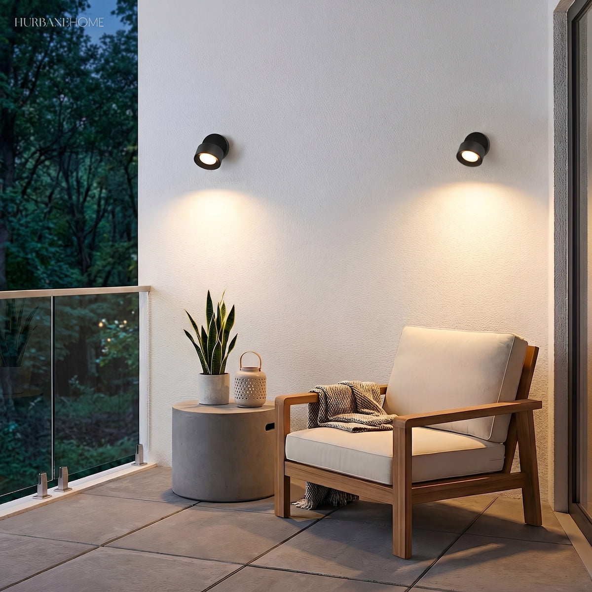 Round wall spot angled downward beside outdoor lounge seating