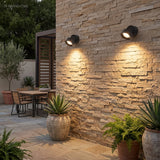 Adjustable spot lighting a stone staircase and planting at night