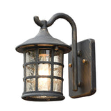 Seeded glass lantern shown from an angle against a plain backdrop