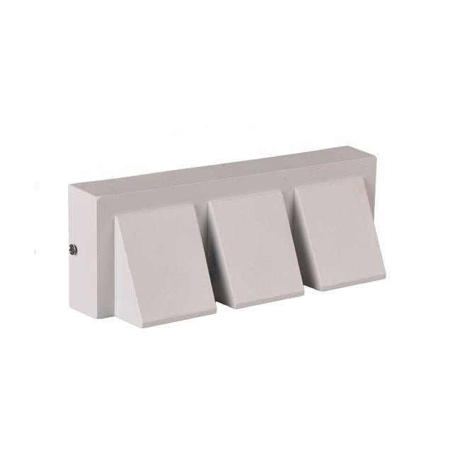 White three head outdoor wall light in a wide horizontal bar