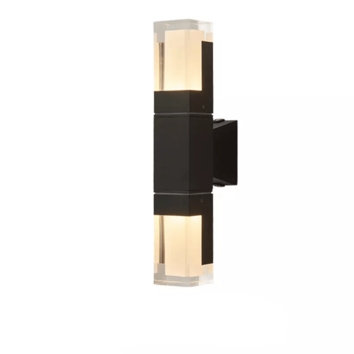 Double head prism wall sconce lit warmly on a pale wall