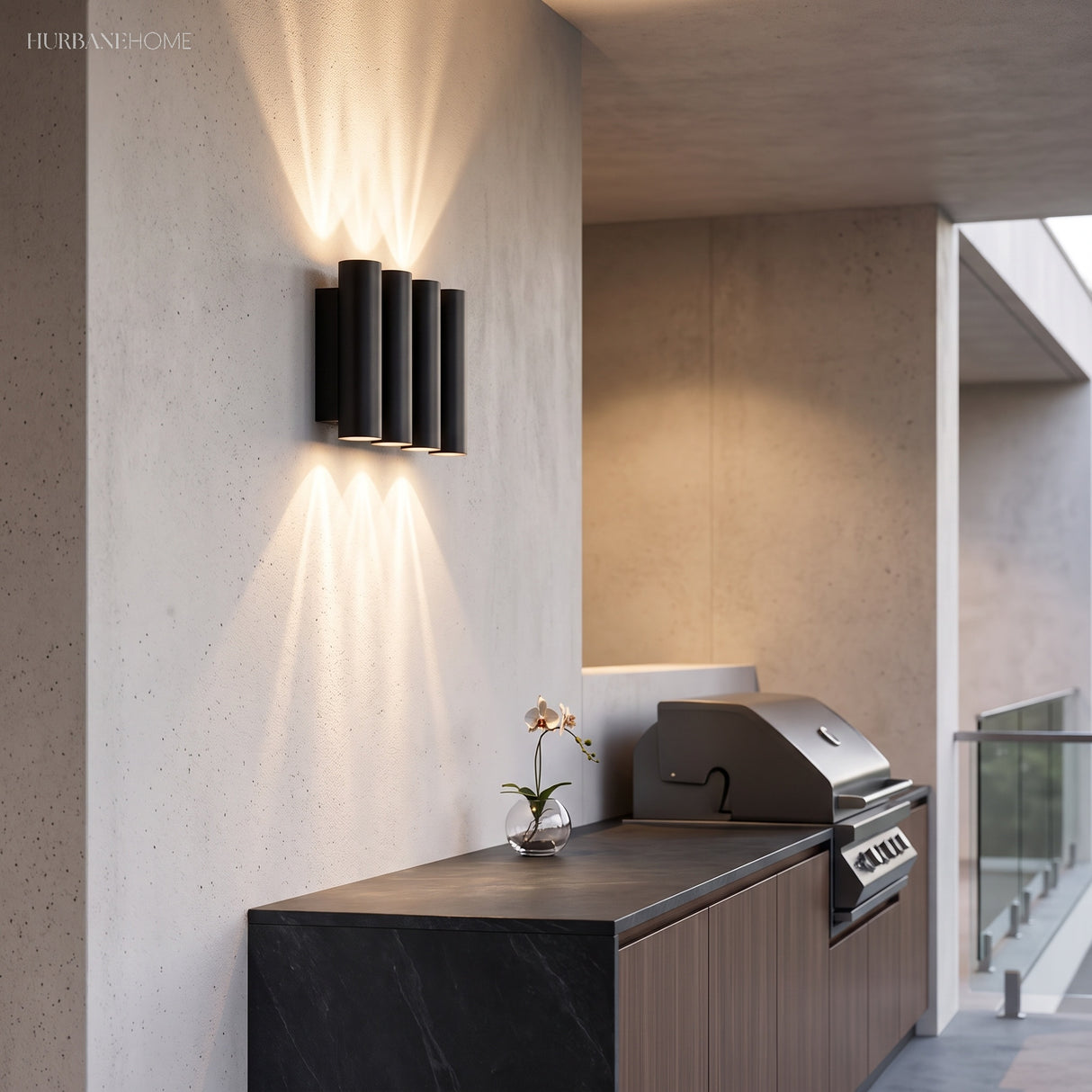 Two up and down sconces lighting a modern house exterior at dusk
