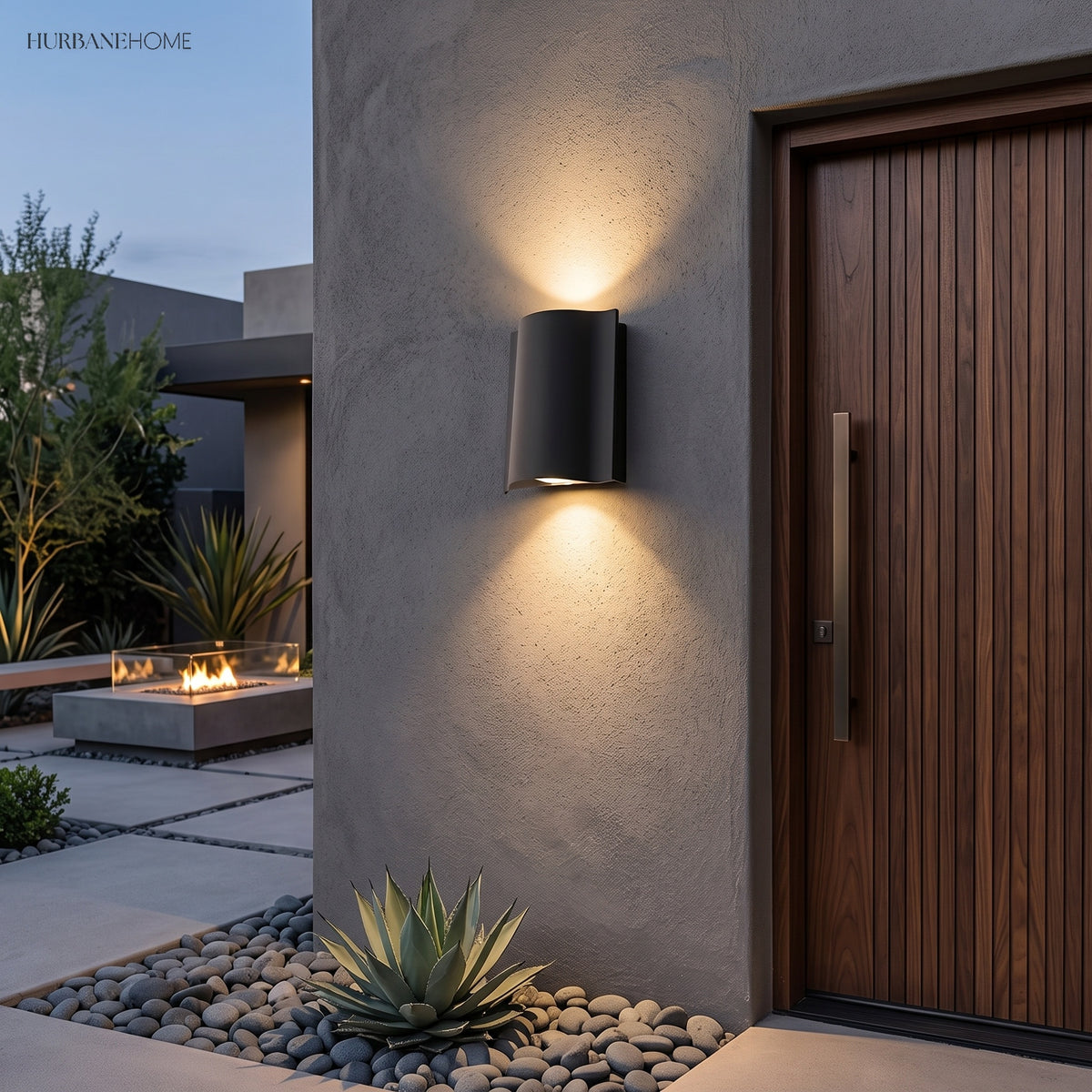 Pair of sconces lighting a covered porch with columns and planting