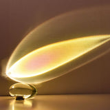 Oval glass ambient lamp shown from a raised angle unlit