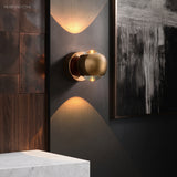 Modern Brass Wall Lamp Jorid Copper LED styled in a room setting