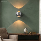 Modern Brass Wall Lamp Jorid Copper LED styled in a room setting