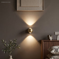 Modern Brass Wall Lamp Jorid Copper LED styled in a room setting