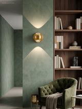 Modern Brass Wall Lamp Jorid Copper LED styled in a room setting