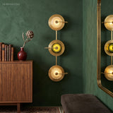 Modern Nordic Wall Sconce Elvira Brass styled in a room setting