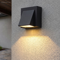 Modern Minimalist Wall Sconce Ayla Waterproof Outdoor styled in a room setting