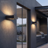 Modern Nico Wall Sconce LED styled in a room setting