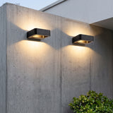 Modern Nico Wall Sconce LED styled in a room setting