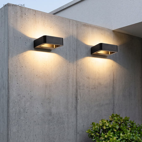 Modern Nico Wall Sconce LED styled in a room setting