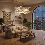 Sculptural paper pendant light lit in a loft living room with city skyline