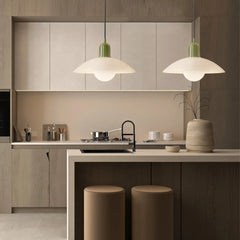Green bodied pendant light with wide disc shade and glass globe