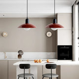 Close view of pendant light shade edge and warm glass globe light