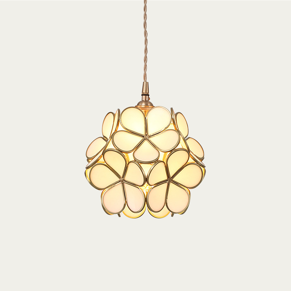 Brass hardware and petal glass shade of the pendant light in detail