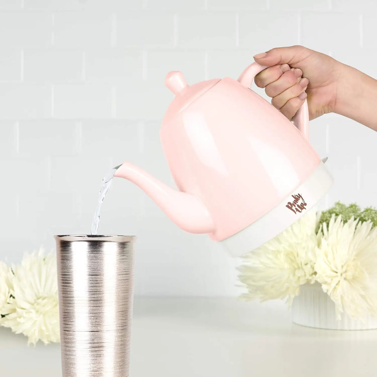 pink tea kettle placed on modern countertop