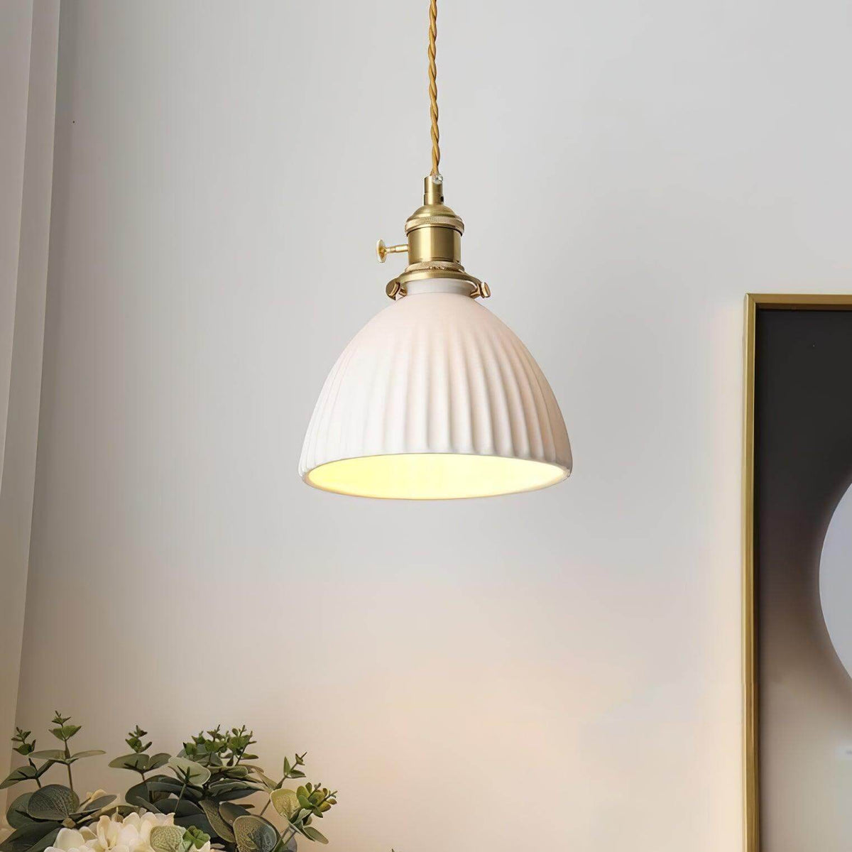 Pleated white ceramic pendant light with a brass lamp fitting, view 7