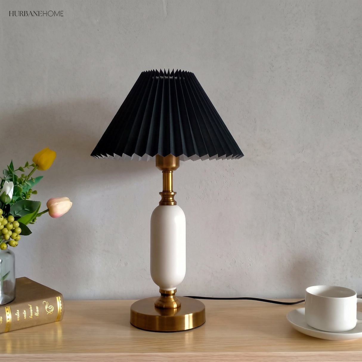 Khaki pleated shade table lamp styled on a light console top