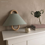 Half-round fabric shade wall sconce lighting a styled corner