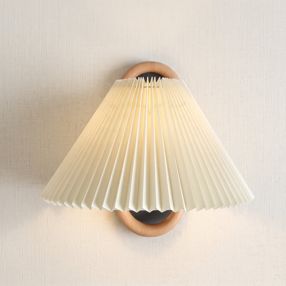 Pleated fabric shade wall sconce with wooden ring bracket, studio product photo