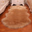 Plush faux sheepskin rug with long pile texture on wooden floor