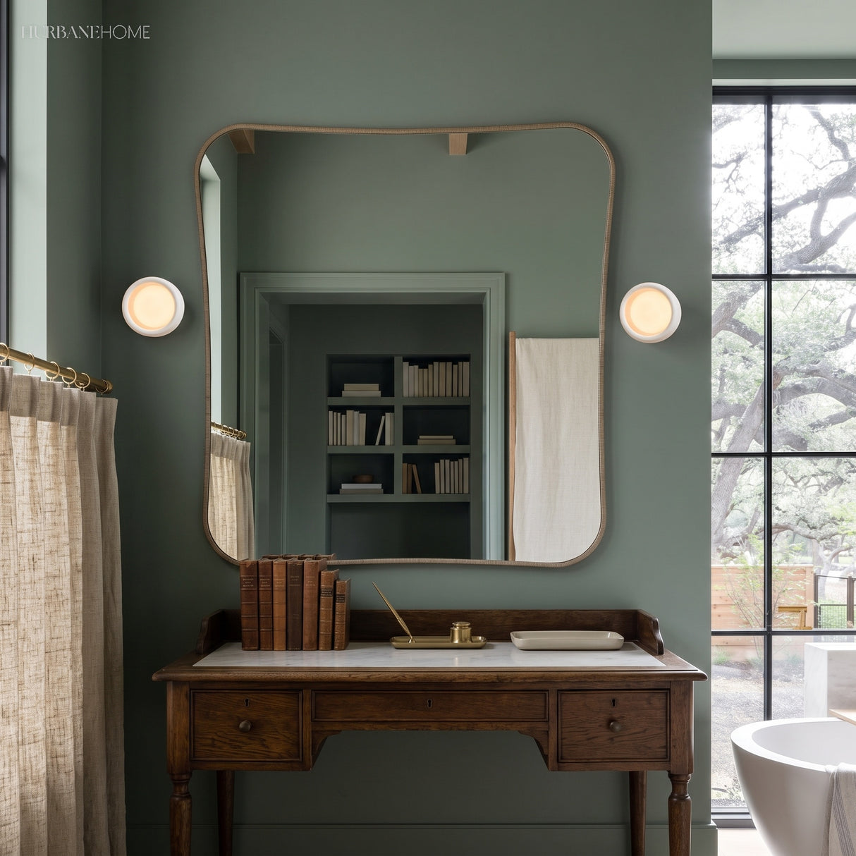 Round porcelain wall lights flanking a mirror above a vintage washstand