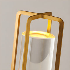 Detail of the gold handle frame around the frosted acrylic cylinder
