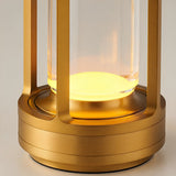 Detail of the stepped gold base and the glowing base of the acrylic tube